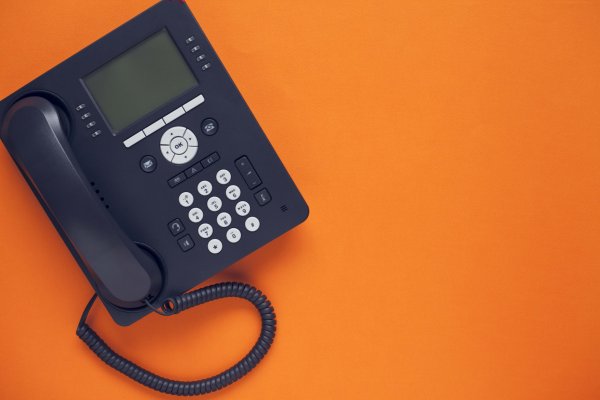1-voip features voip service black voip phone on orange background